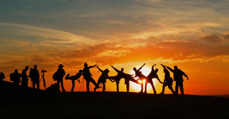 Travel Cameras - Silhouette of People during Golden Hour