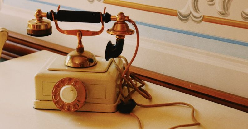 Phone Mounts - A vintage telephone on a table with a clock