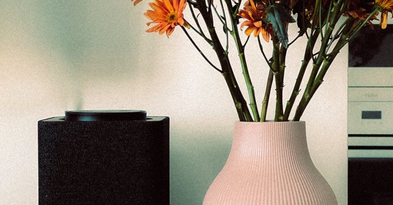 Air Purifiers - A vase with flowers in it and a coffee mug