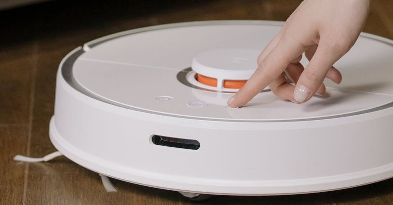 Robot Vacuums - White and Orange Plastic Container