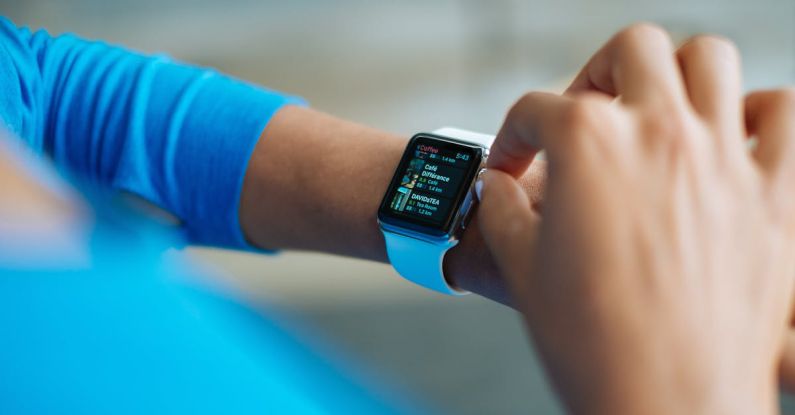 Smartwatch - Person in Blue Long Sleeve Shirt Using Smart Watch