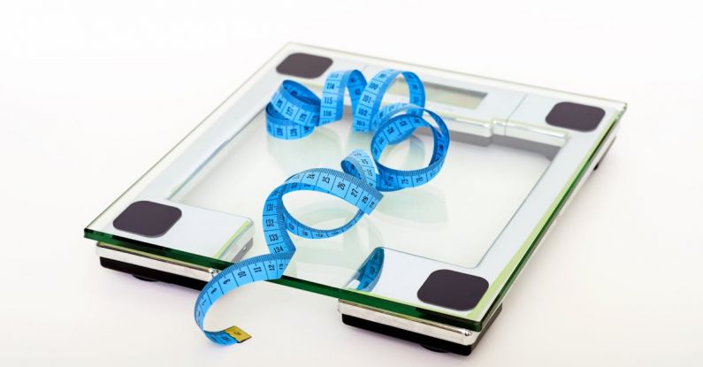 Scales - Blue Tape Measuring on Clear Glass Square Weighing Scale