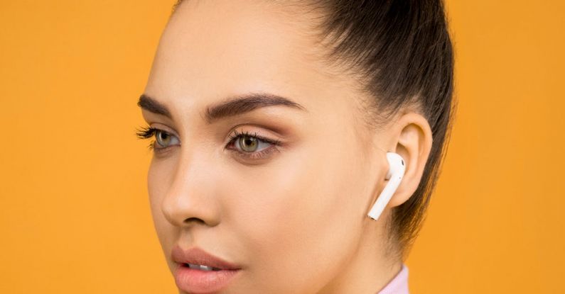 Earbuds - Close-up Photography of a Woman