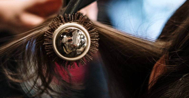 Hair Dryers - Woman in Black and Gold Round Watch