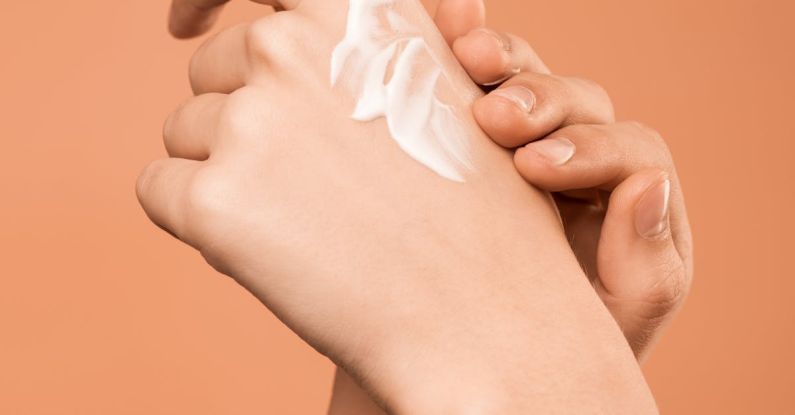 Skin Care Devices - Person Applying Hand Cream