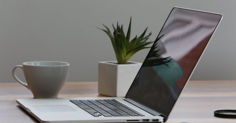 Laptops - Silver Laptop and White Cup on Table