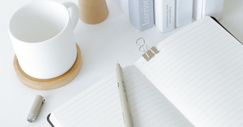 Desk Organizers - Notebook opened on desk near books