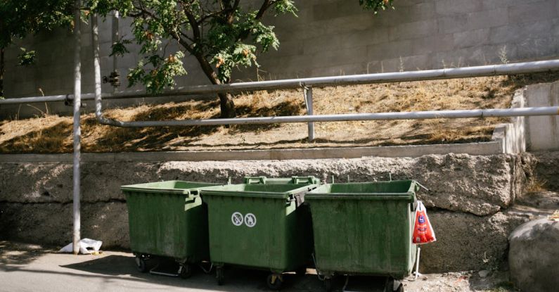 Litter Boxes - Green Garbage Bin on the Roadside